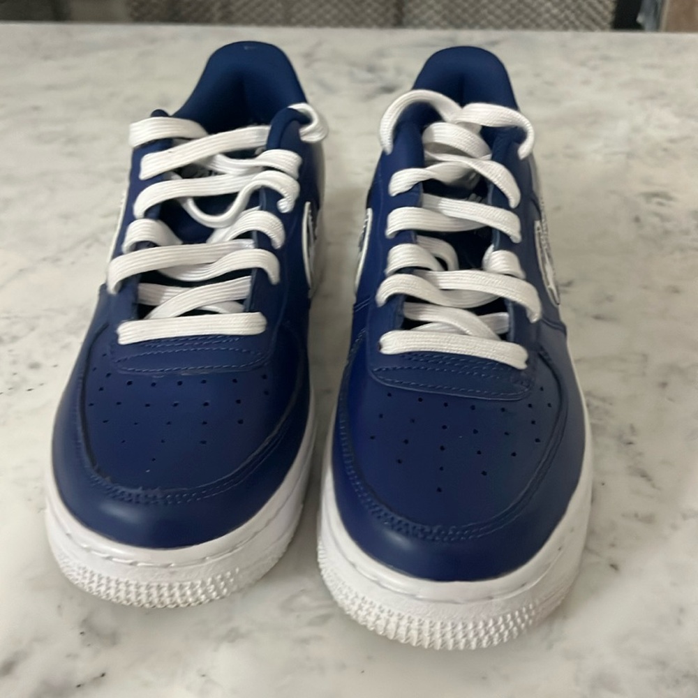Grade school navy blue and white Air Force ones